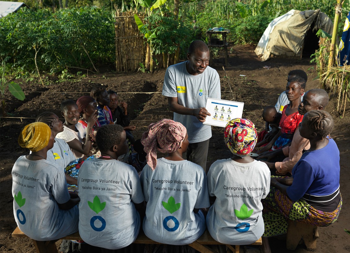 Roger teaches fellow volunteers about the importance of a healthy diet.