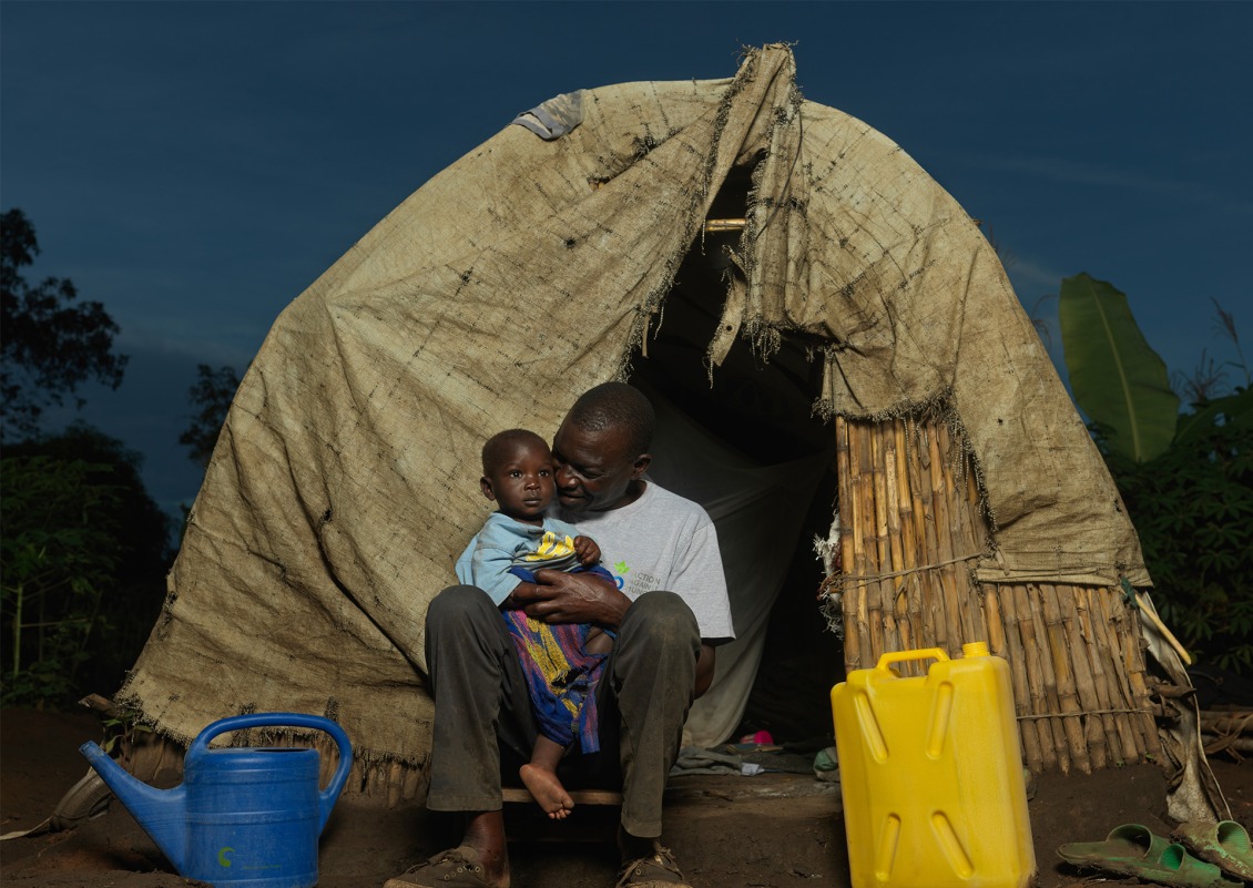 One year old, Musa Moize, and his father Roger at home.