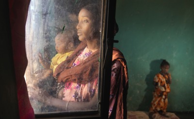 Darmi and her daughters inside their home.