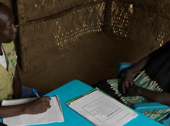 An Action Against Hunger social worker with a woman in South Sudan.