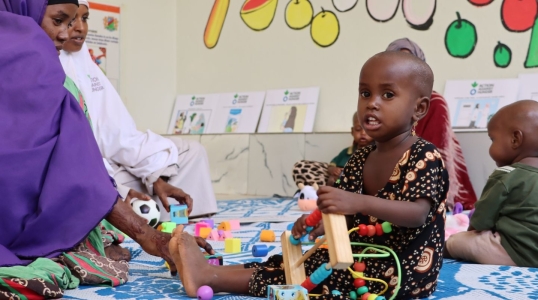 Caregivers and children connect at the stabilization center's play area.