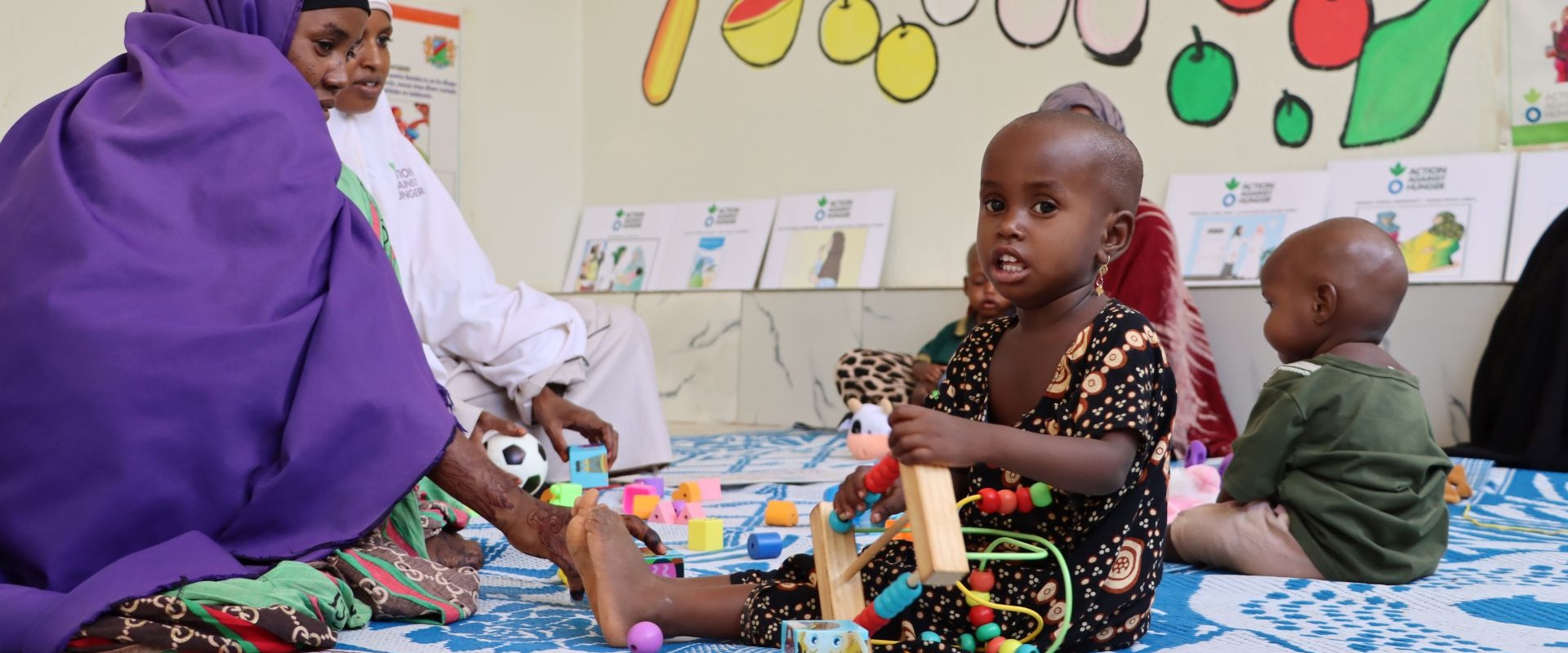 Caregivers and children connect at the stabilization center's play area.