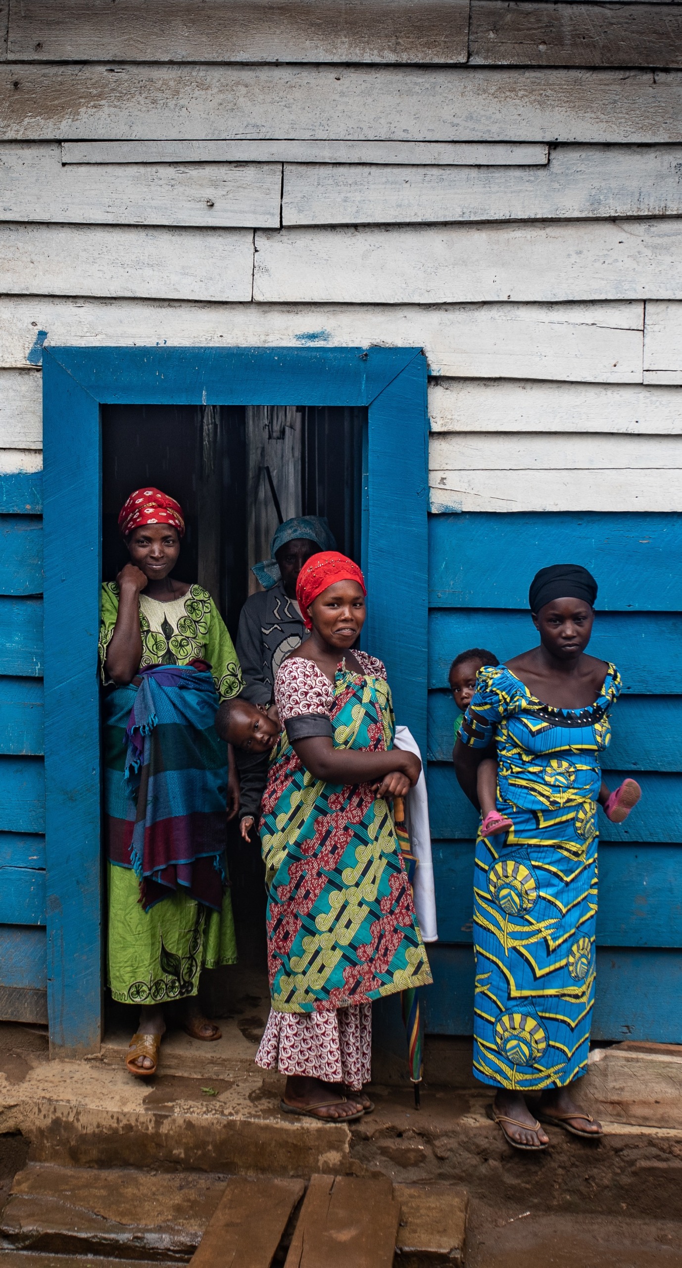 Women wait for prenatal appointments outside of Kibarizo Health Center.
