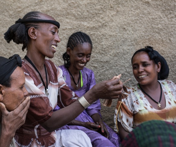 Women meet for their weekly gathering of their community savings and loans group.