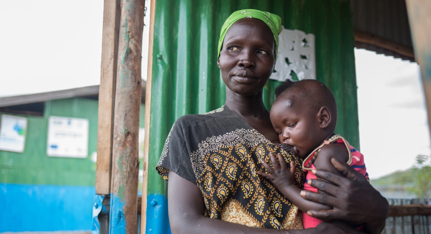 Nyalat, a South Sudanese refugee in Ethiopia, breastfeeds her young son.