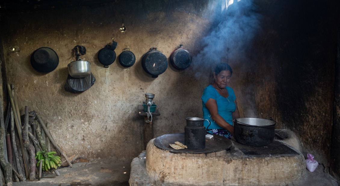 Alicia, in her kitchen in Guatemala, prepares corn tortillas, the basis of her family's daily diet.