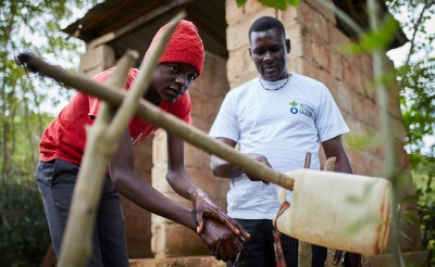 Action Against Hunger teams carry out sensitization activities with families to teach about good hygiene and encourage use of latrines.