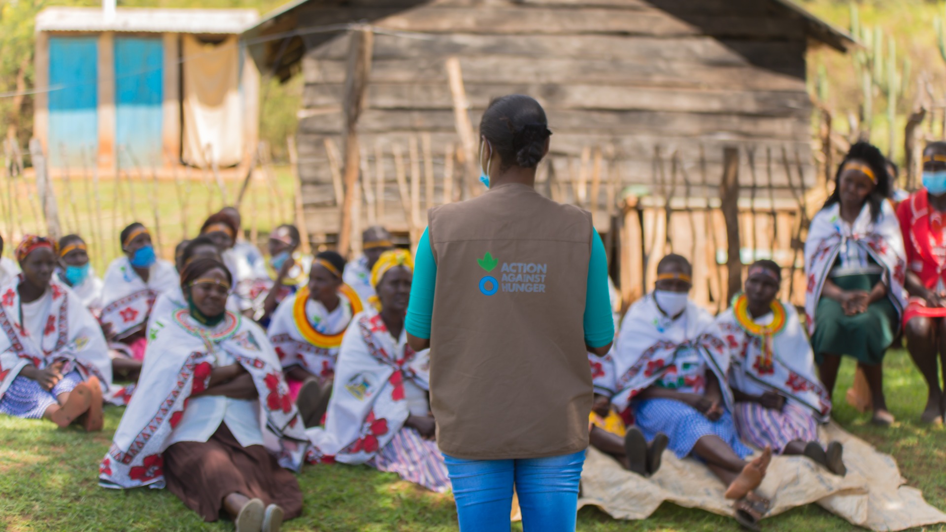 Mothers sit together and hear about health, nutrition, and other topics in their support group.