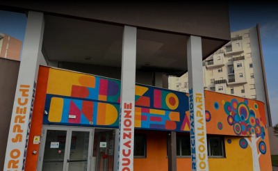 A building with a colorful wall in Italy