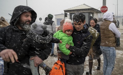 Ukrainian refugees face winter weather as they cross the border into Moldova.