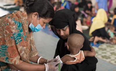A child is measured for malnutrition at one of Action Against Hunger's nutrition centers in Cox's Bazar.