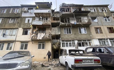 A damaged residential apartment building following shelling