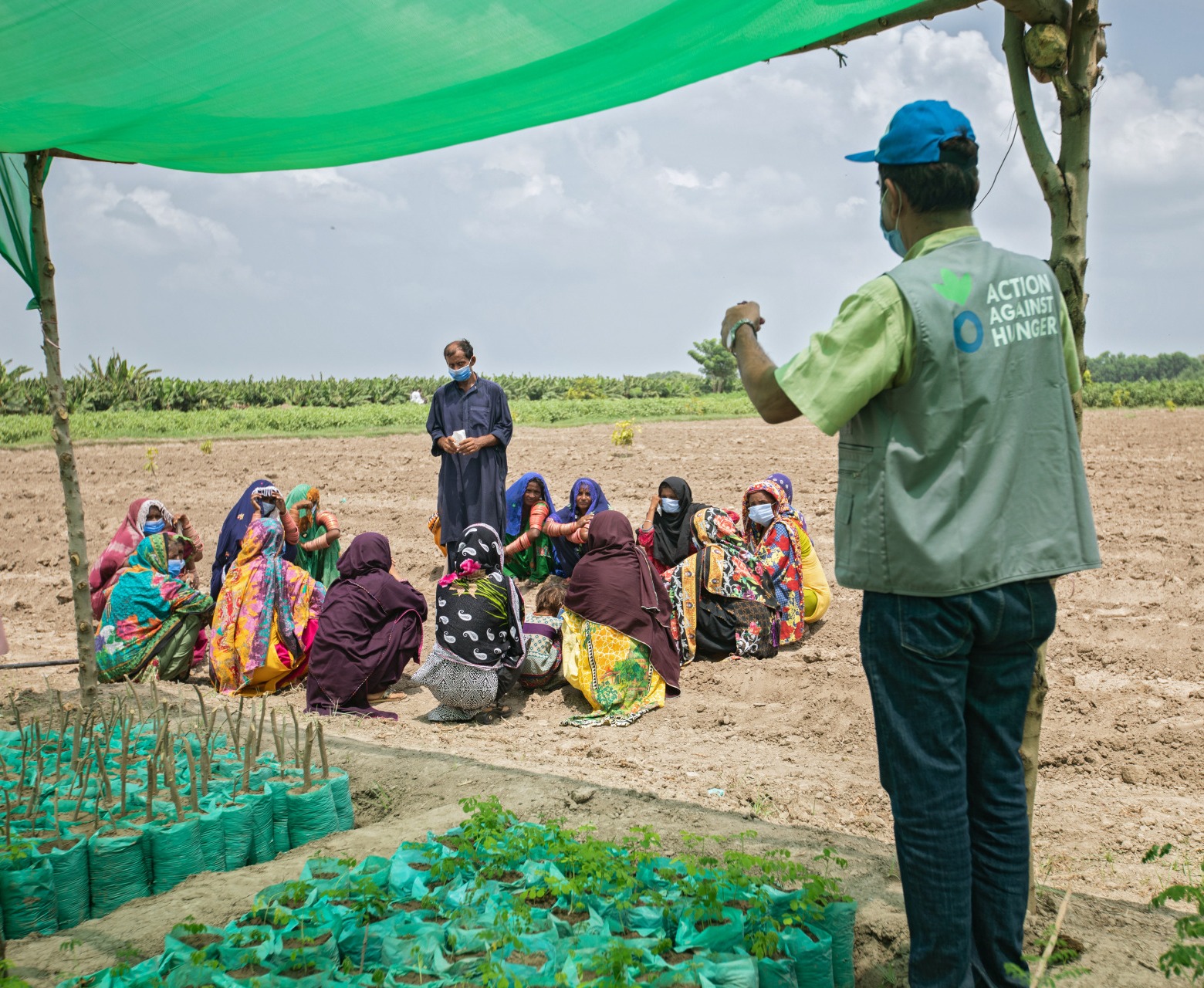Ashraf Qasqariya, a trainer at the Farmer Field School (FFS), conducts a Community Mobilization Session on Kitchen Gardening in Jamot Village