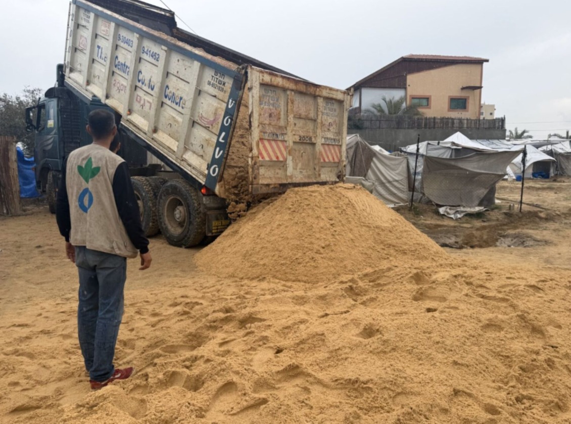 Action Against Hunger delivering sand to protect against flooding.