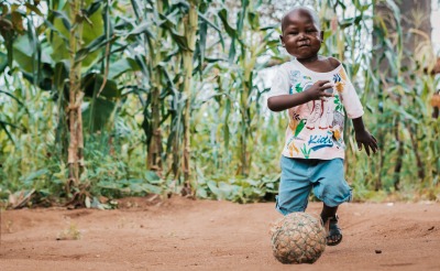 Rodrick, 4, plays with a ball at his grandparents' home.