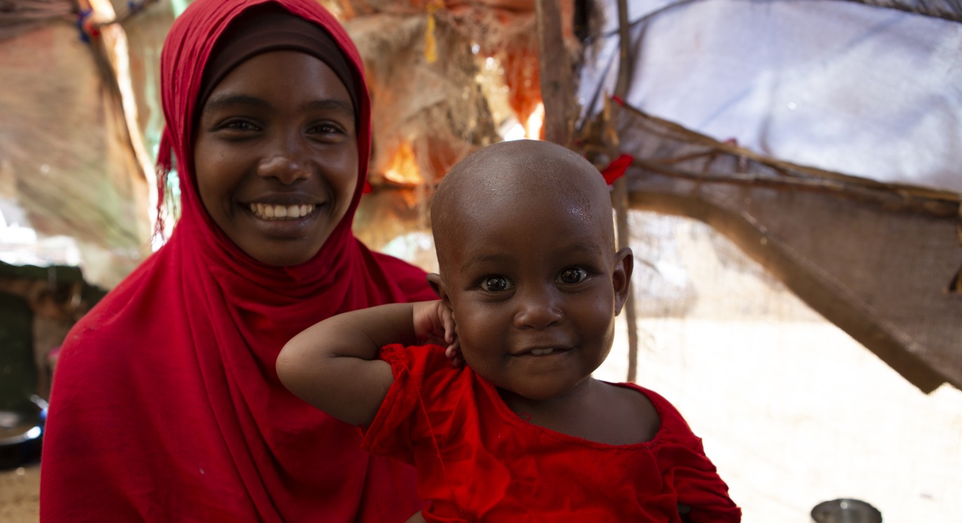 Fatuma and Halima at home. The family lives with Fatuma's uncle in a displacement camp outside of Mogadishu, Somalia.