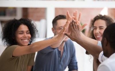 Colleagues giving each other a high five