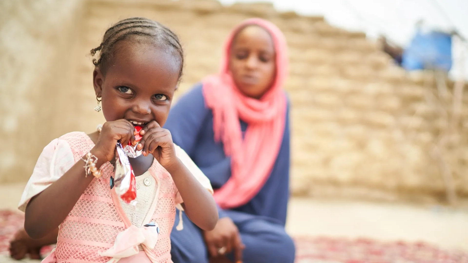 Achta, a four-year-old girl in Chad, eating ready to use therapeutic food.
